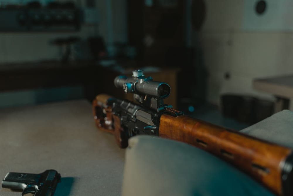 Close-up of a rifle with a mounted scope